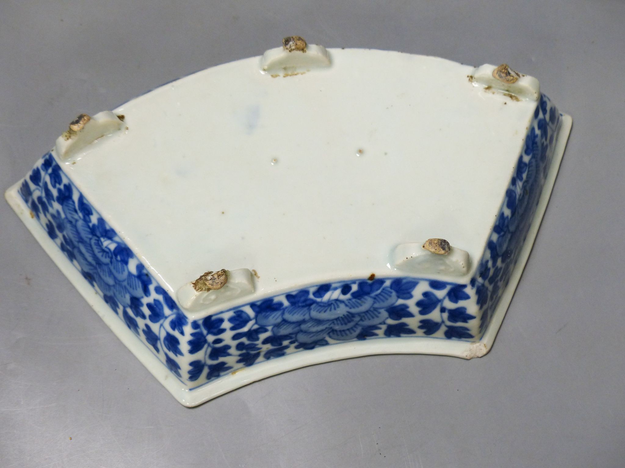 A 19th century Chinese blue and white jar and cover, four character Kangxi mark, 22cm high and a Chinese blue and white fan shape dish, 25.5cm